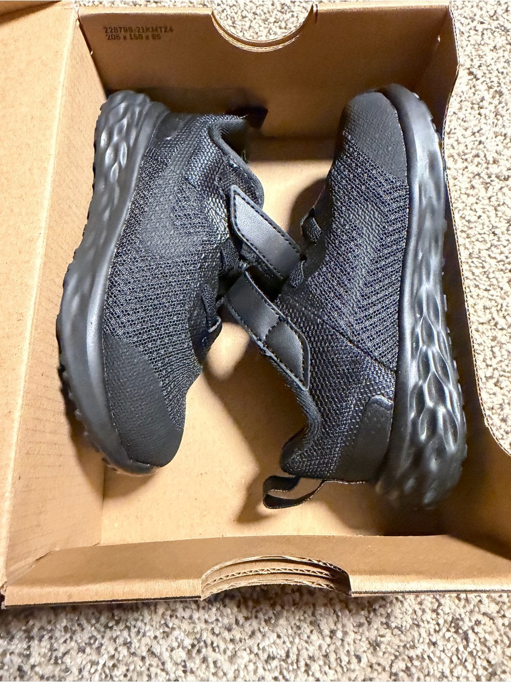 Kids All-Black Nike Athletic Sneakers